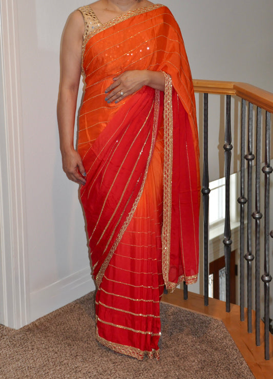 Two-Tone Red and Orange Saree with Gold Embroidery Border